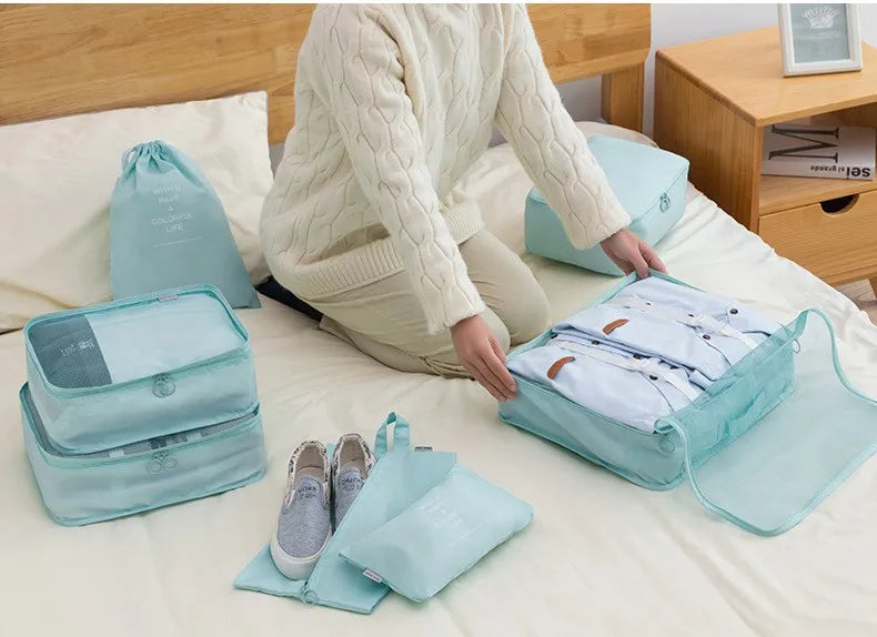 Travel packing cubes organizing clothes and shoes